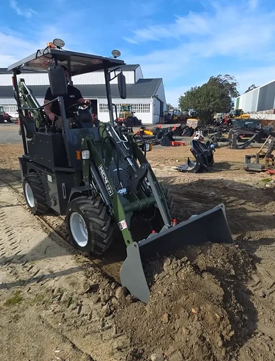 MCM 18X TLB front loader in the yard