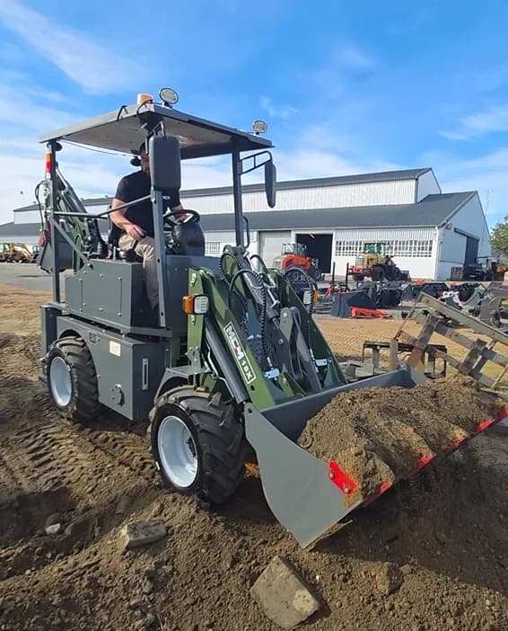 MCM 18X TLB with a full loader bucket