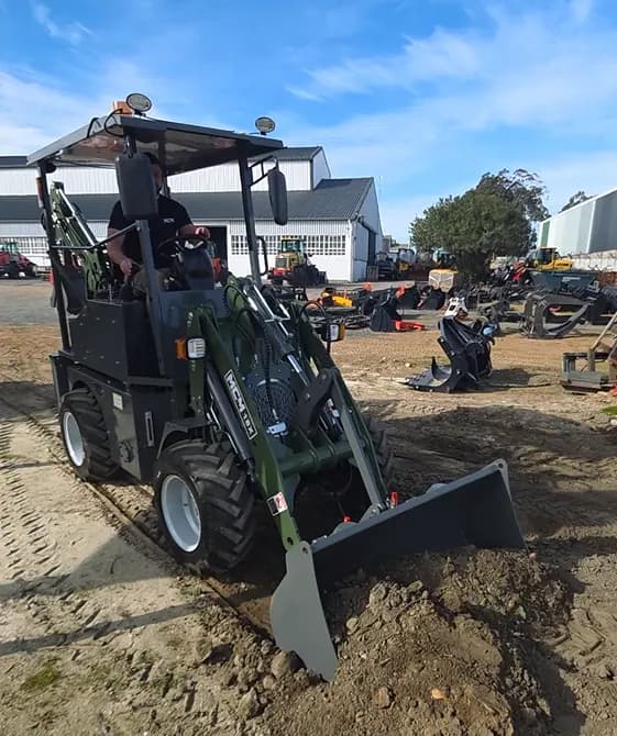 MCM 18X TLB with the loader bucket lowered