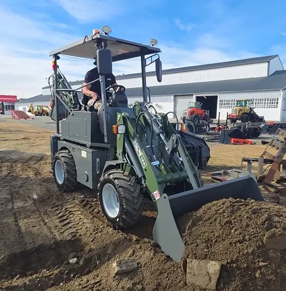 MCM 18X TLB operator doing loader work