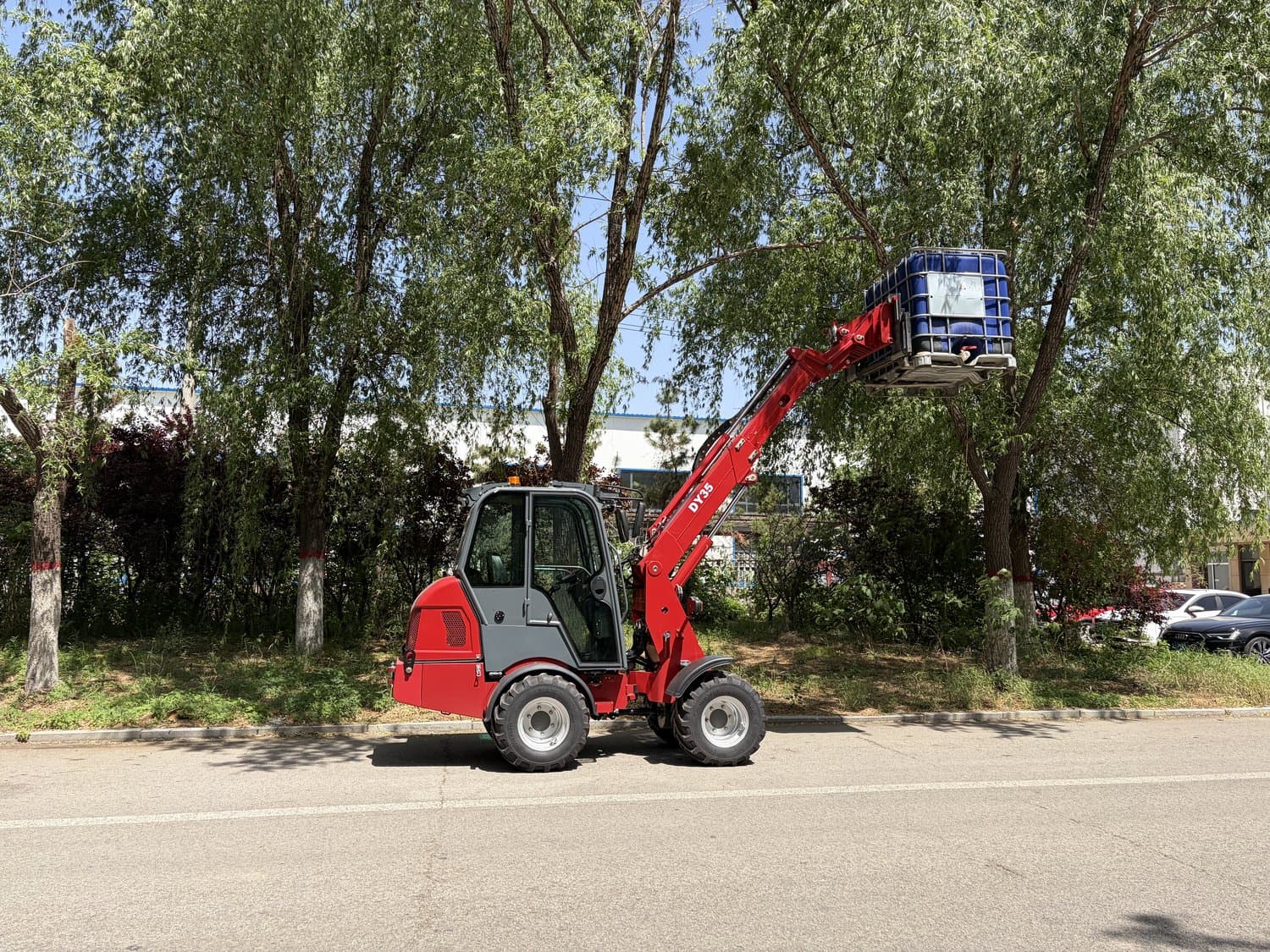 MCM DY35T telescopic loader lifting a load on forks at full reach