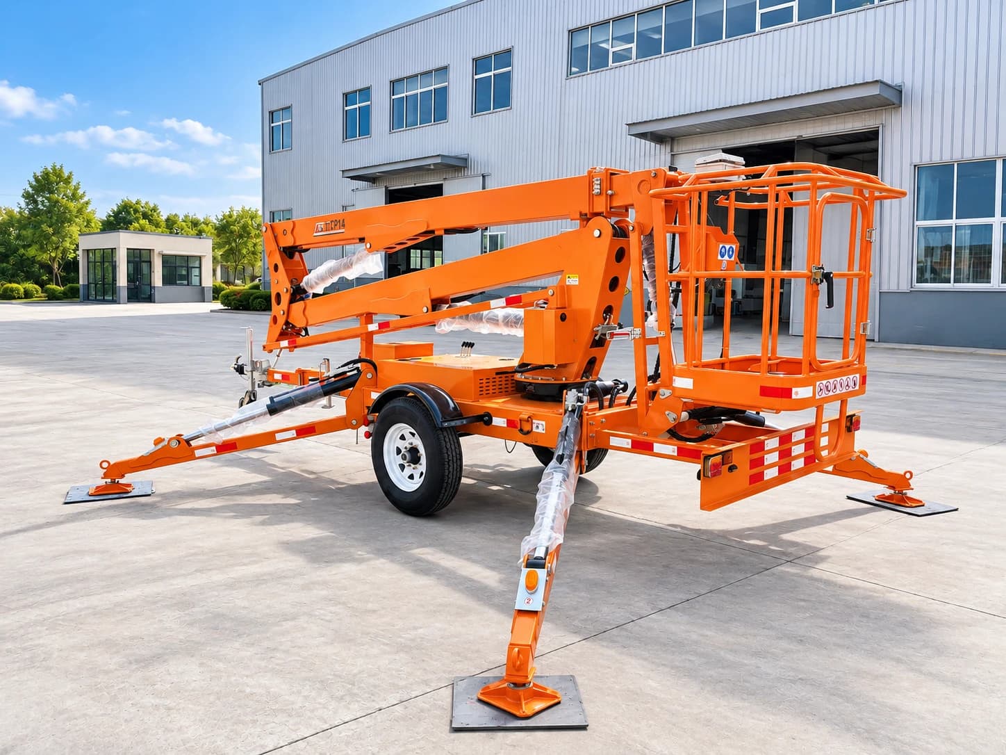 MCM TCP14 Cherry Picker / Trailer-Mounted Towable Boom Lift, three-quarter view of the platform basket and outriggers