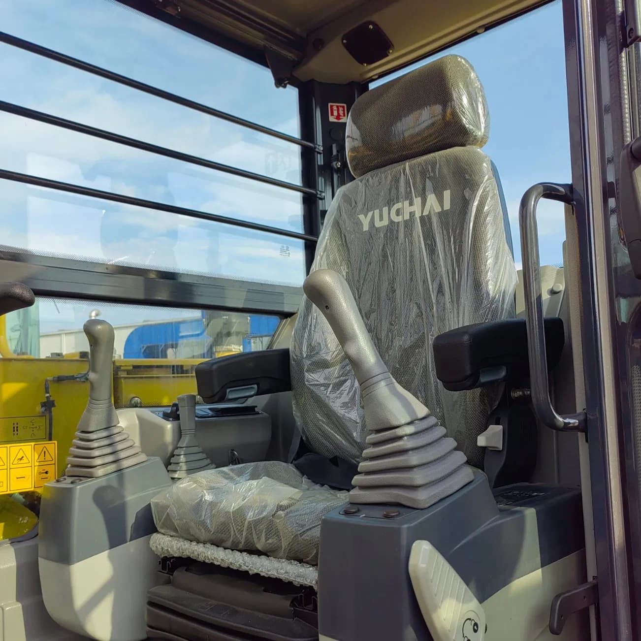 Yuchai YC80 excavator suspension seat and pilot joysticks