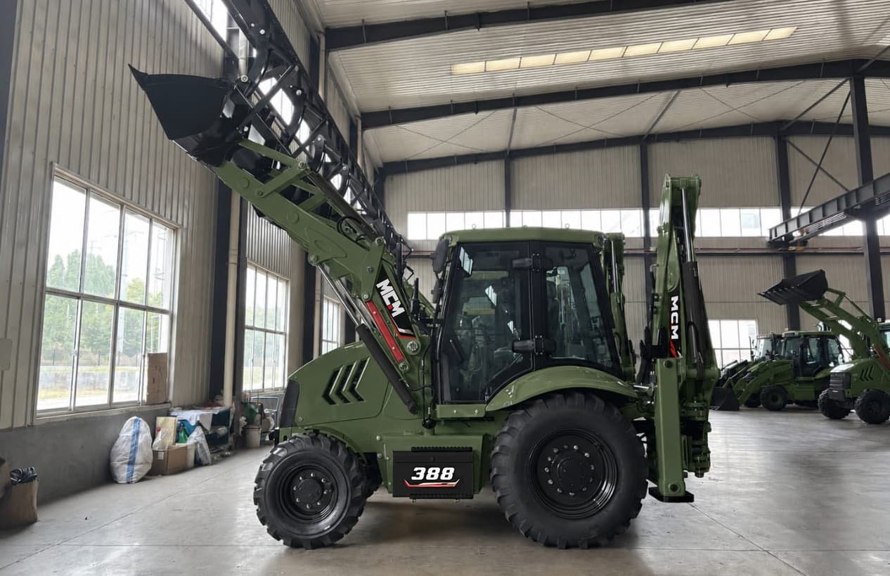 MCM 388 TLB backhoe loader side view with front loader raised