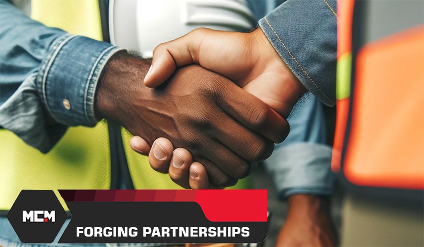 Construction professionals shaking hands - MCM building lasting partnerships
