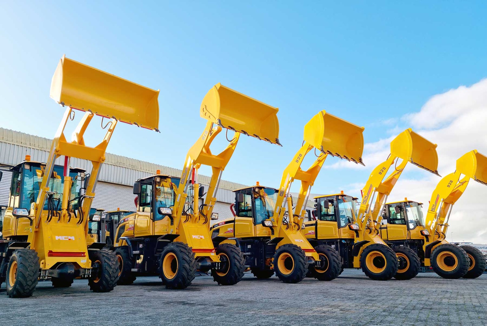 A row of MCM wheel loaders in stock and ready for delivery