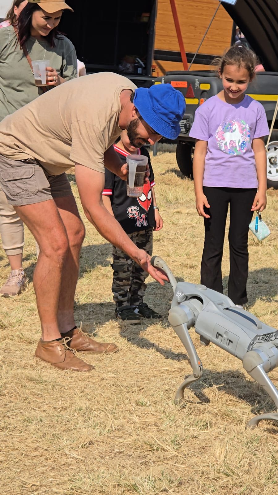 Visitors and children meeting the Unitree Go2 quadruped robot on the MCM stand at KragDag 2026