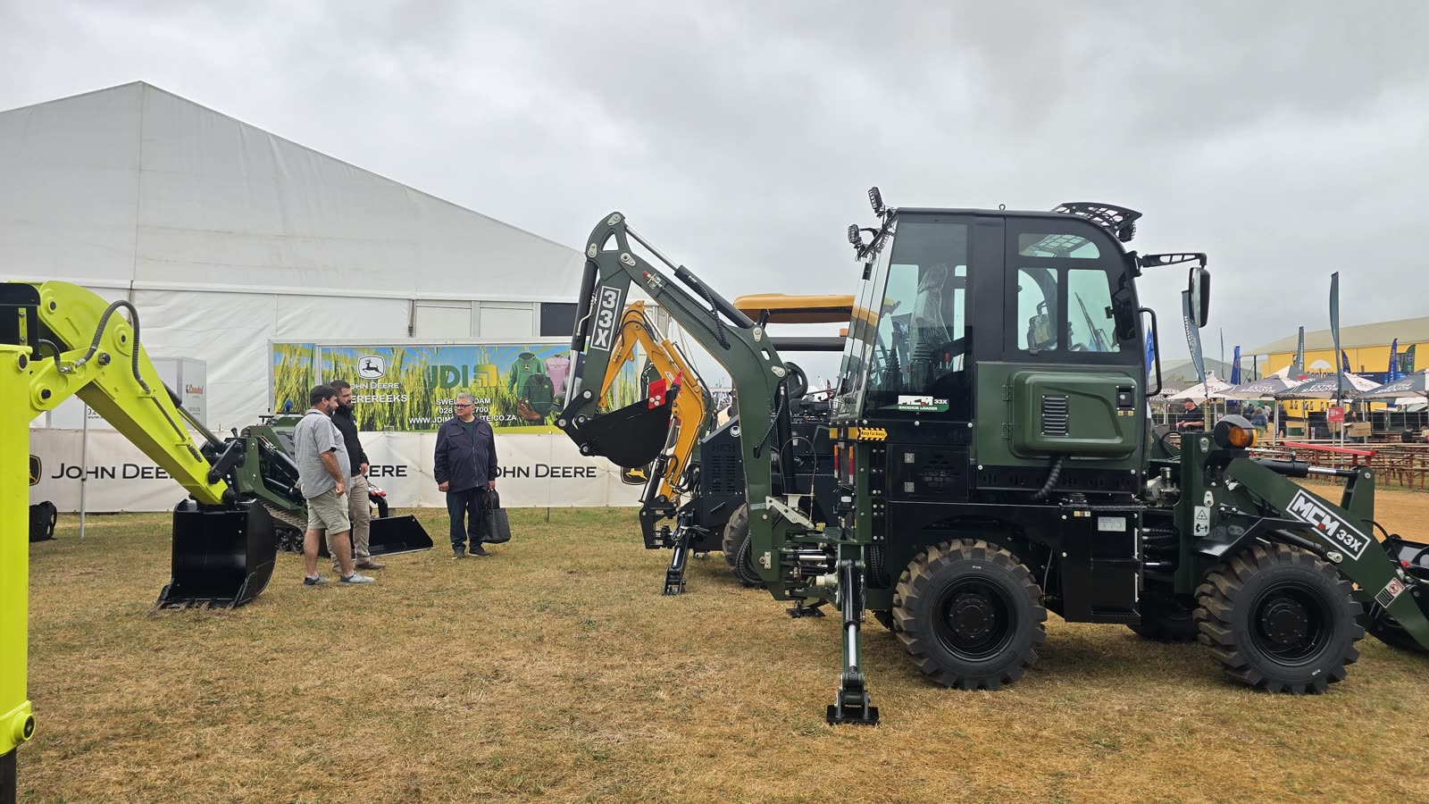 Farmers talking to the MCM team next to the MCM 33X TLB at NAMPO Cape 2026