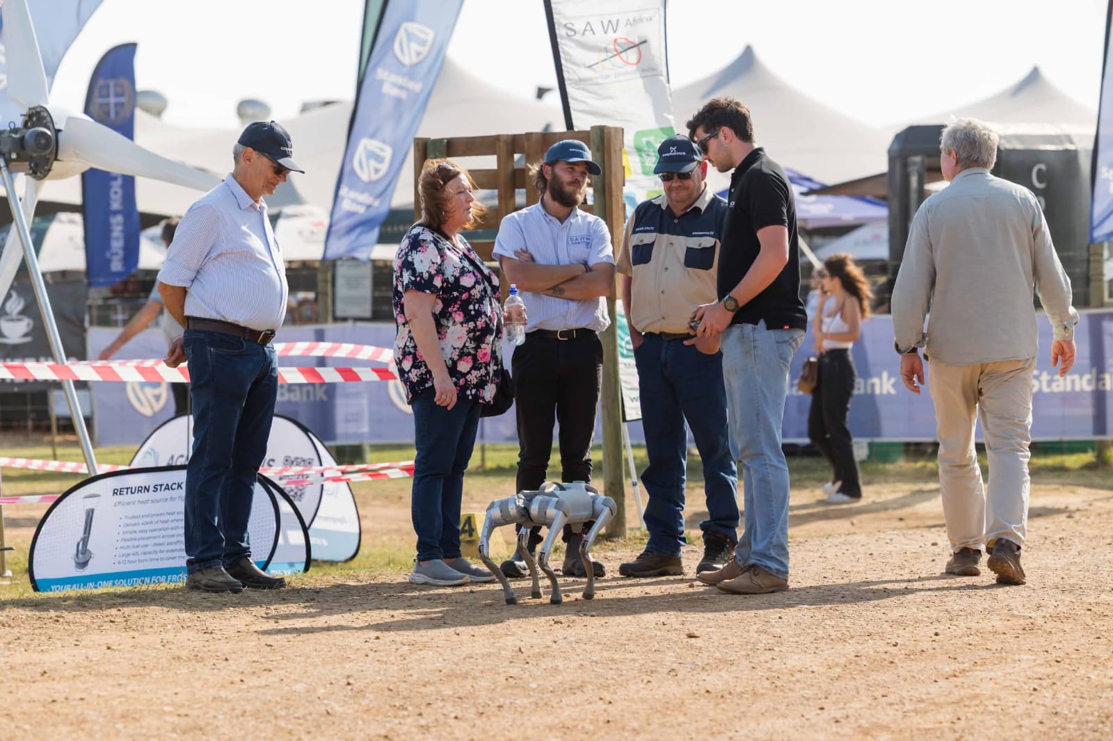 The MCM Robotics team demonstrating the Unitree Go2 robot dog to visitors at NAMPO Cape 2026 in Bredasdorp