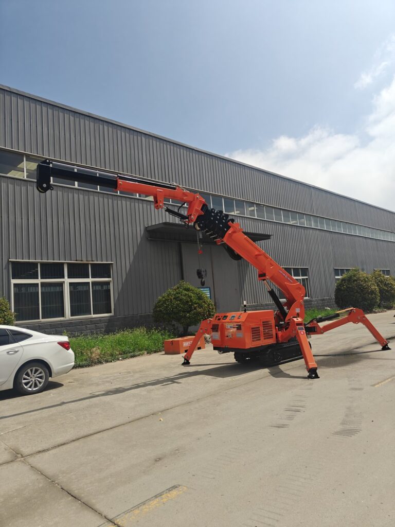 A spider crane with its boom extended outside a warehouse