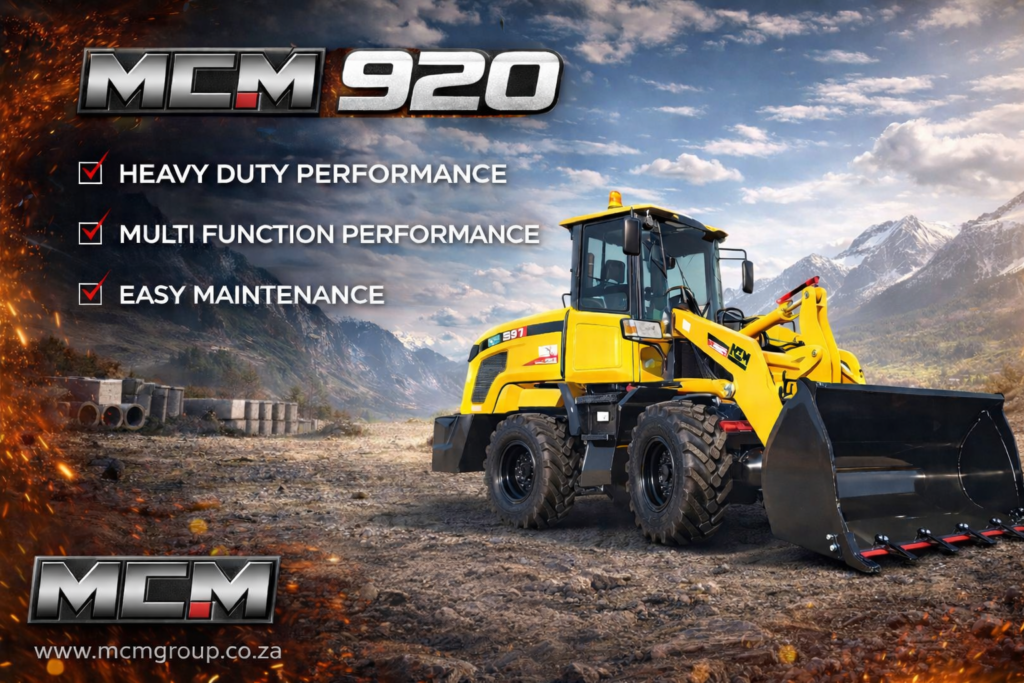 Small wheel loader working on a South African farm loading soil into a trailer