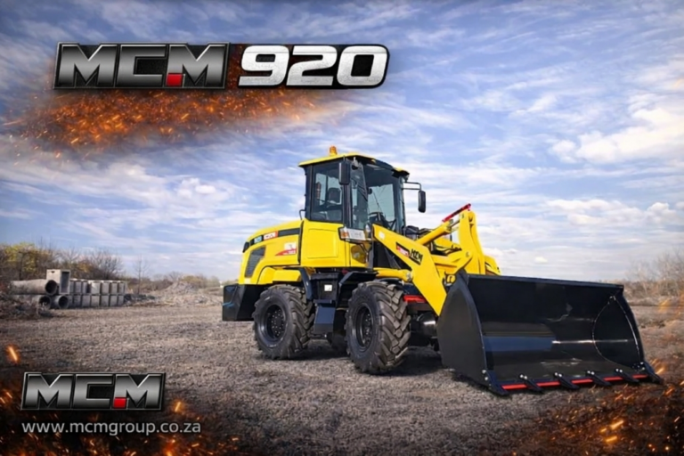 Small wheel loader working on a South African farm loading soil into a trailer